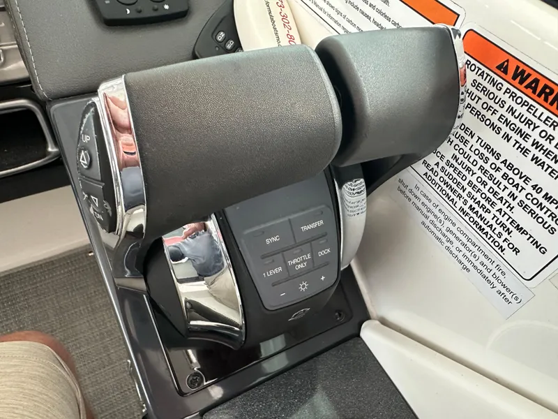 Slide: The Image of Throttle controls of a 2016 Formula 330 Crossover Bowrider boat. - 9