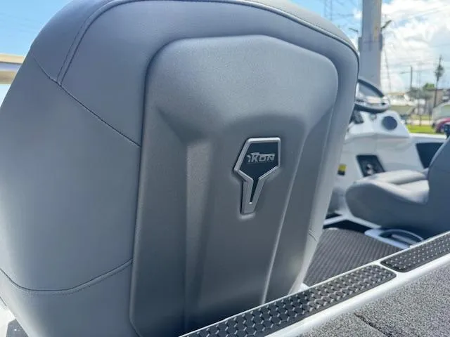 Slide: The Image of 2025 iKon VLX21 boat interior with gray seating and storage compartments. - 14