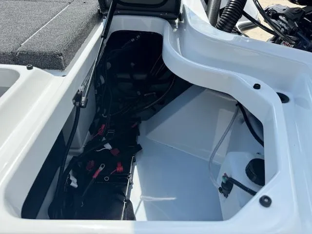 Slide: The Image of 2025 iKon VLX21 boat deck with gray carpet and storage compartments. - 19