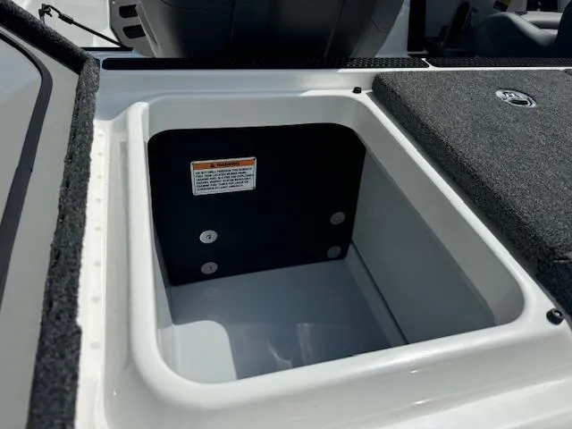 Slide: The Image of 2025 iKon VLX21 boat interior with open storage compartments and steering console. - 20