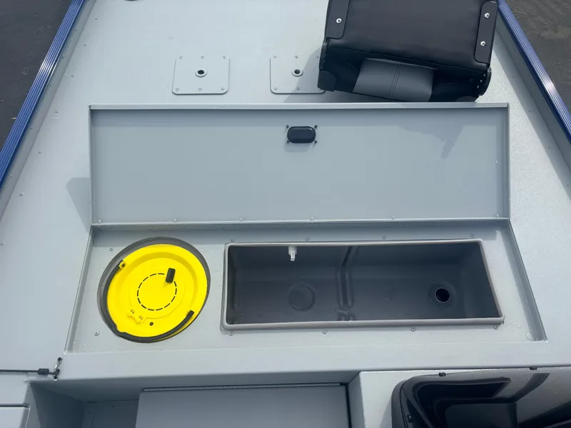 Slide: The Image of 2025 Crestliner 1600 Storm boat interior with storage compartments and seating. - 3