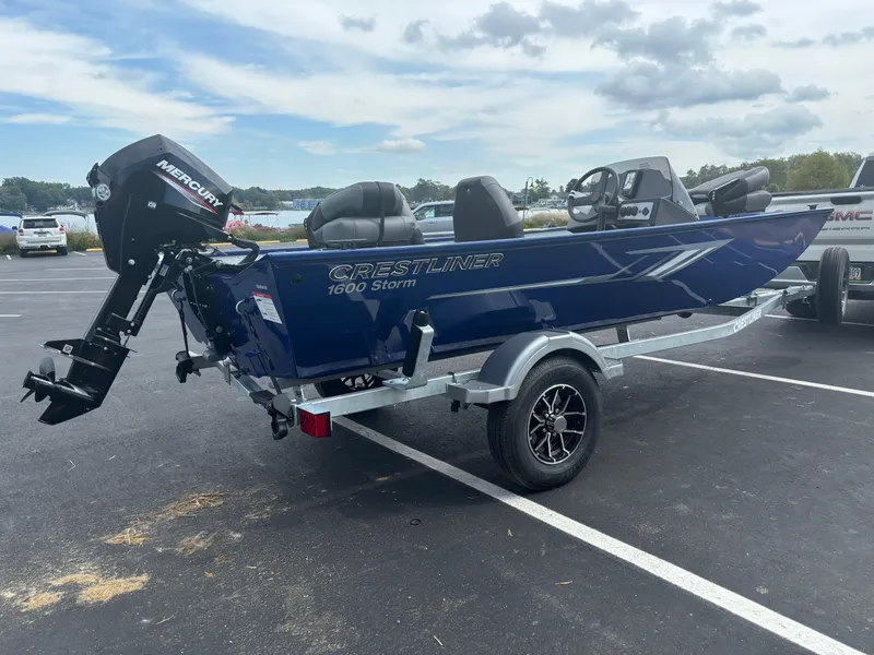 Slide: The Image of 2025 Crestliner 1600 Storm boat on trailer in parking lot. - 8