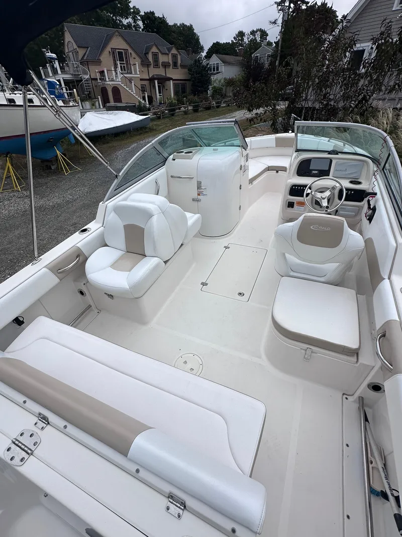 Slide: The Image of 2018 Robalo R227 Dual Console boat with spacious seating and modern dashboard. - 7