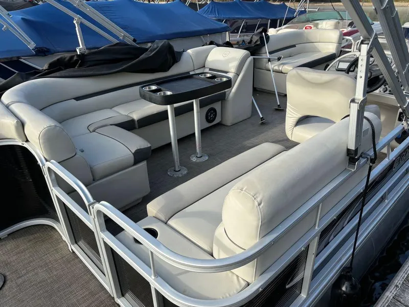 Slide: The Image of 2020 Sweetwater SW 2186 SB pontoon boat with spacious seating and table setup. - 10