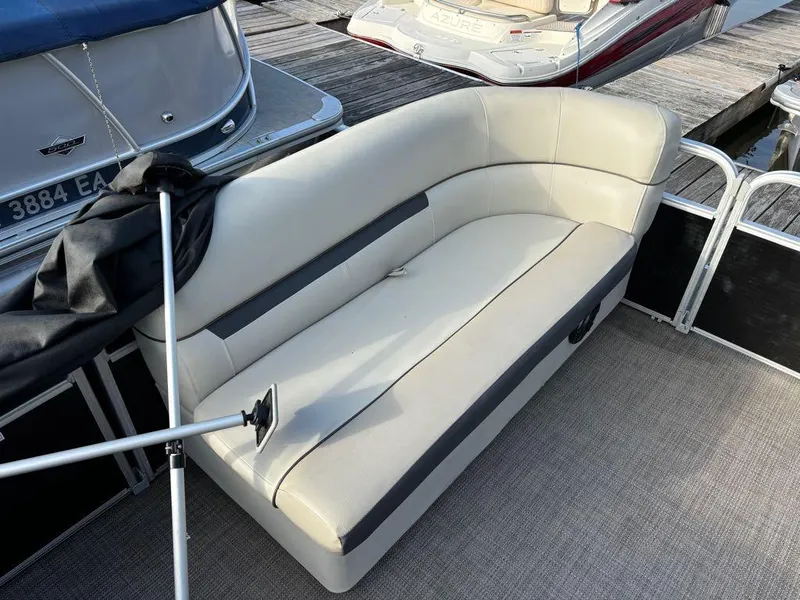 Slide: The Image of Sweetwater 2020 SW 2186 SB boat with beige seating at a dock. - 3