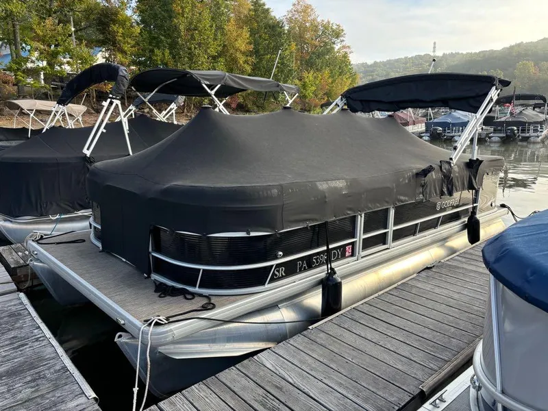 Slide: The Image of 2020 Sweetwater SW 2186 SB pontoon boat docked with black cover. - 5