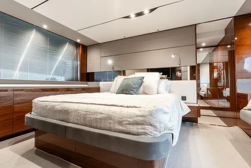 Slide: The Image of Luxurious bedroom interior of 2019 Princess V65 yacht with modern design and elegant furnishings. - 38