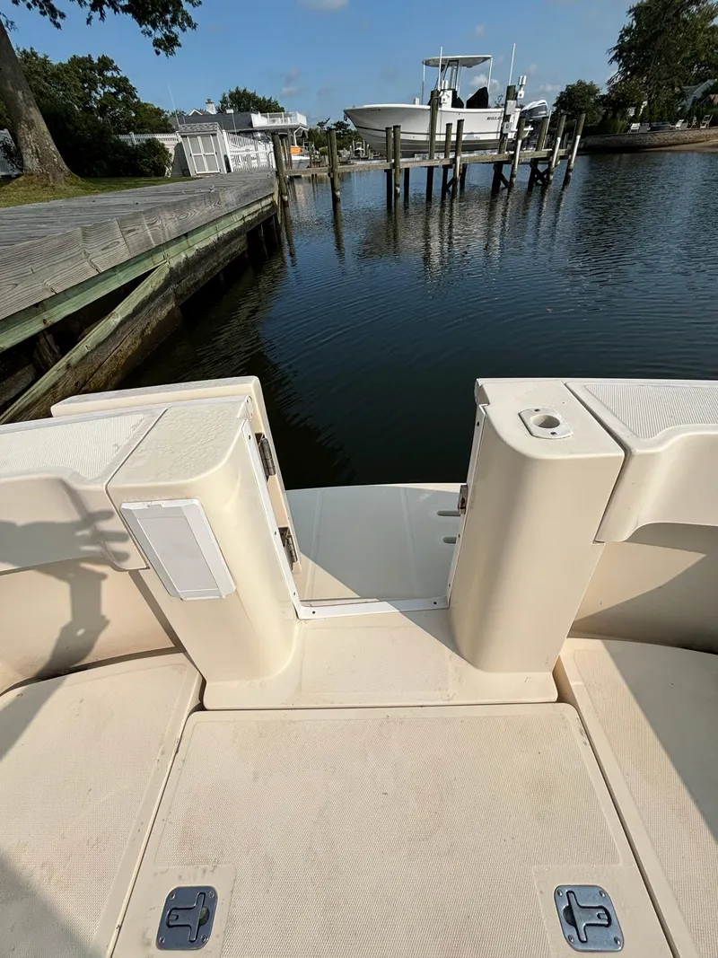 Slide: The Image of 2005 Mainship Pilot 30-II Sedan at dock, calm water, clear sky. - 13
