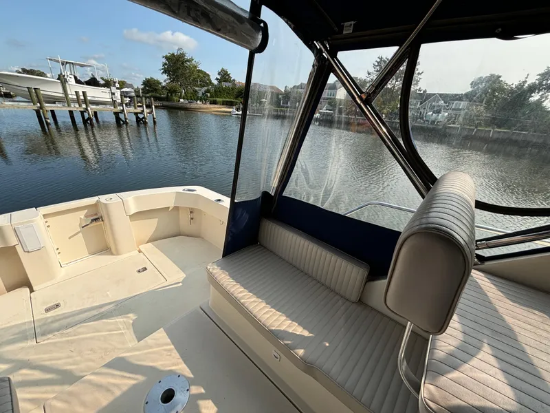 Slide: The Image of 2005 Mainship Pilot 30-II Sedan boat interior with waterfront view. - 15