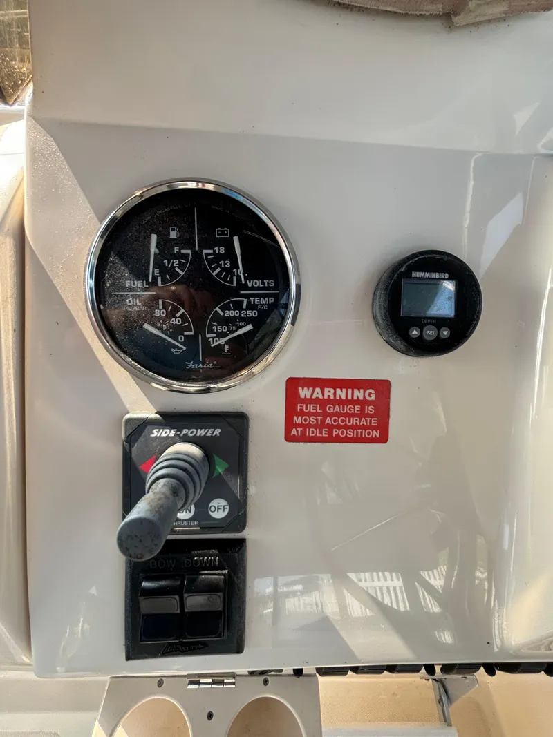 Slide: The Image of 2005 Mainship Pilot 30-II Sedan dashboard with gauges and controls. - 25