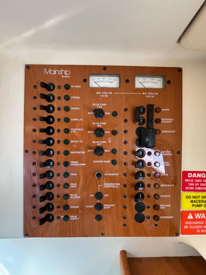 Slide: The Image of Control panel of 2005 Mainship Pilot 30-II Sedan with gauges and switches. - 34