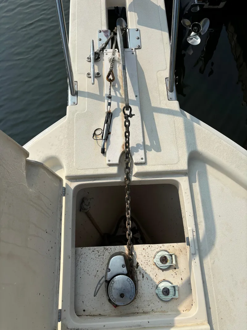 Slide: The Image of 2005 Mainship Pilot 30-II Sedan anchor chain and storage compartment on deck. - 37