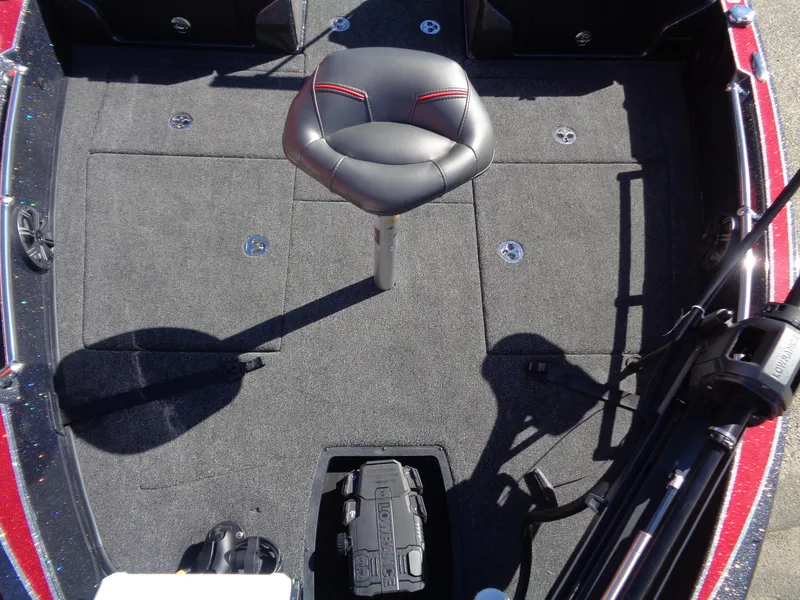 Slide: The Image of 2024 Nitro ZV20 Pro boat interior with a central seat and carpeted flooring. - 10