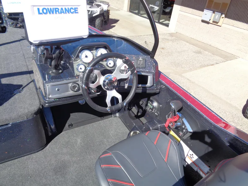 Slide: The Image of 2024 Nitro ZV20 Pro boat cockpit with steering wheel and Lowrance electronics. - 11