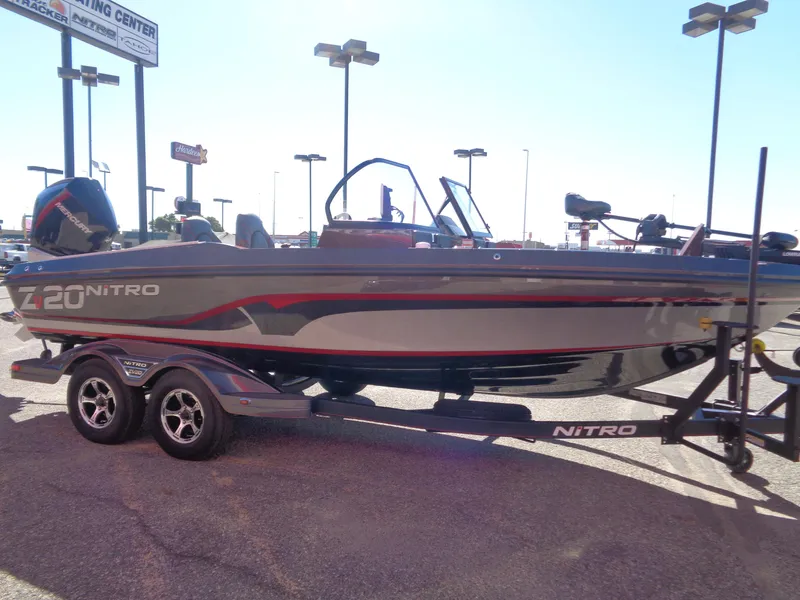 Slide: The Image of 2024 Nitro ZV20 Pro fishing boat on trailer in parking lot. - 5