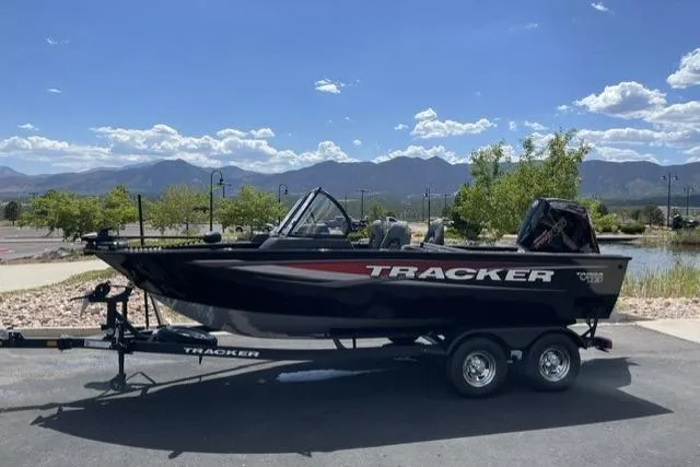 The Image of 2025 Tracker Targa V-18 WT boat on trailer, scenic mountain backdrop. - 0