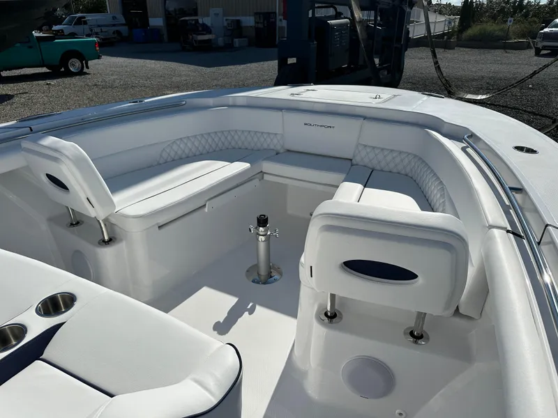 Slide: The Image of Luxurious 2025 Southport 33 DC boat interior with white seating and modern design. - 10