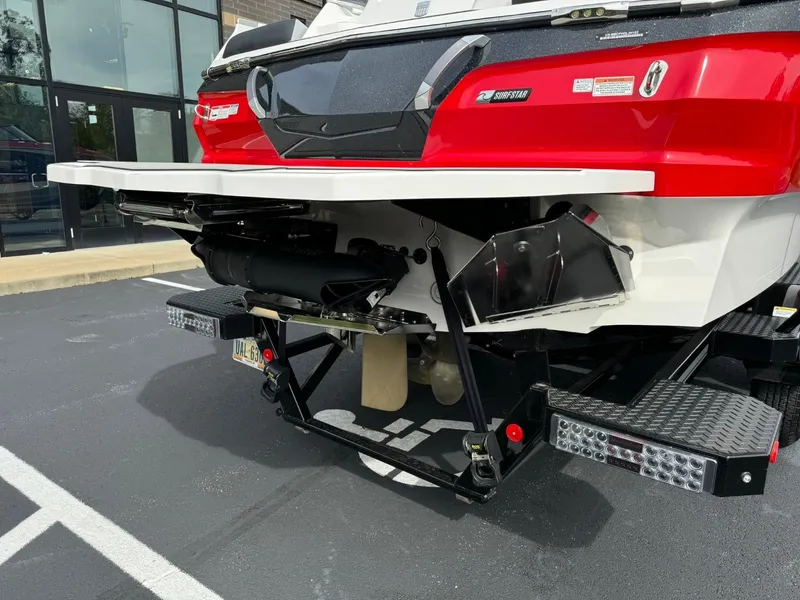 Slide: The Image of 2022 MasterCraft X24 boat rear view, showcasing red and white design with advanced features. - 4