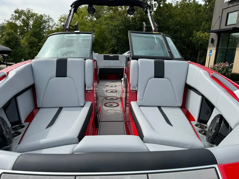 Slide: The Image of 2022 MasterCraft X24 boat interior with sleek seating and modern design. - 8