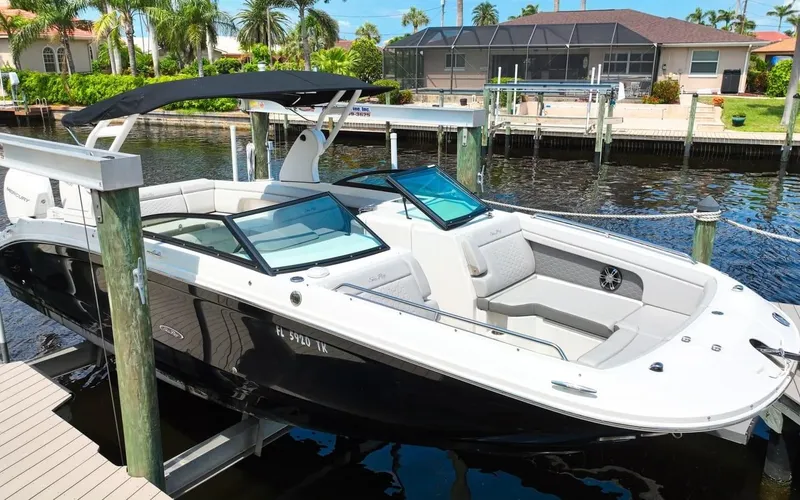 Slide: The Image of 2020 Sea Ray SDX 290 Outboard boat docked in sunny marina. - 1