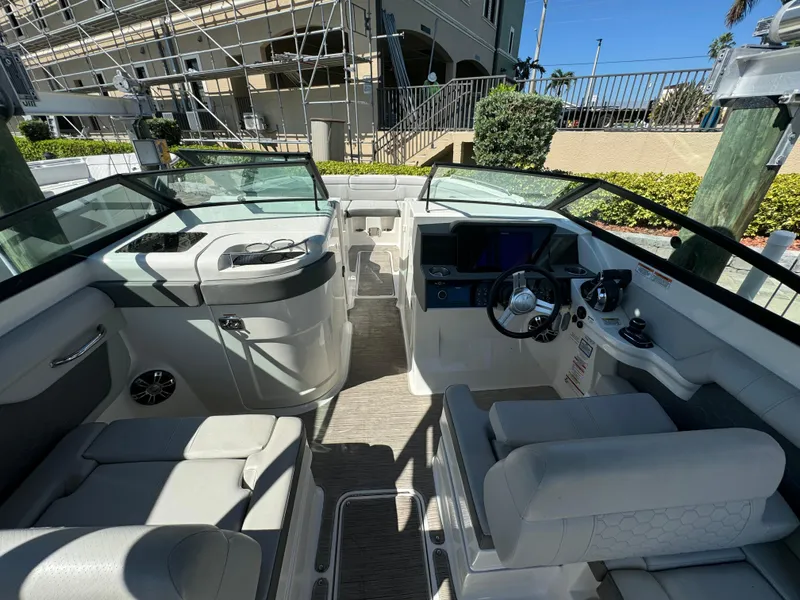 Slide: The Image of 2020 Sea Ray SDX 290 Outboard boat interior with seating and helm. - 19