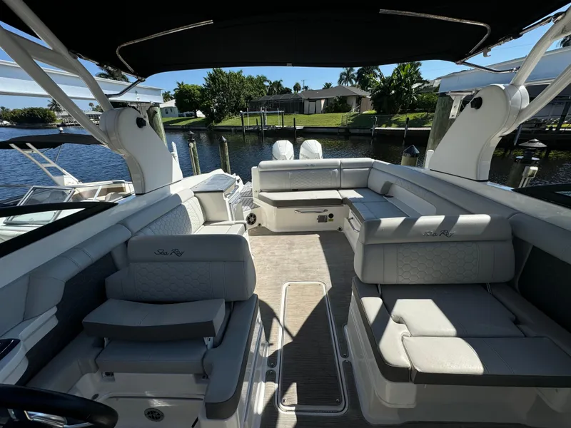 Slide: The Image of 2020 Sea Ray SDX 290 Outboard boat interior with spacious seating and elegant design. - 26