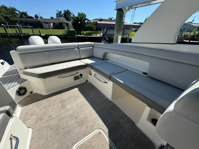 Slide: The Image of 2020 Sea Ray SDX 290 Outboard interior with spacious seating and modern design. - 8
