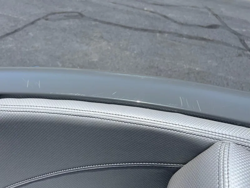 Slide: The Image of Close-up of 2017 MasterCraft XT21 boat interior with visible scratches. - 11