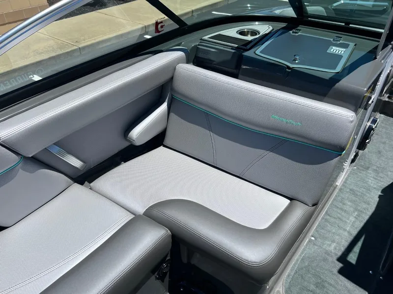 Slide: The Image of 2017 MasterCraft XT21 boat interior with gray seating and cup holder. - 13