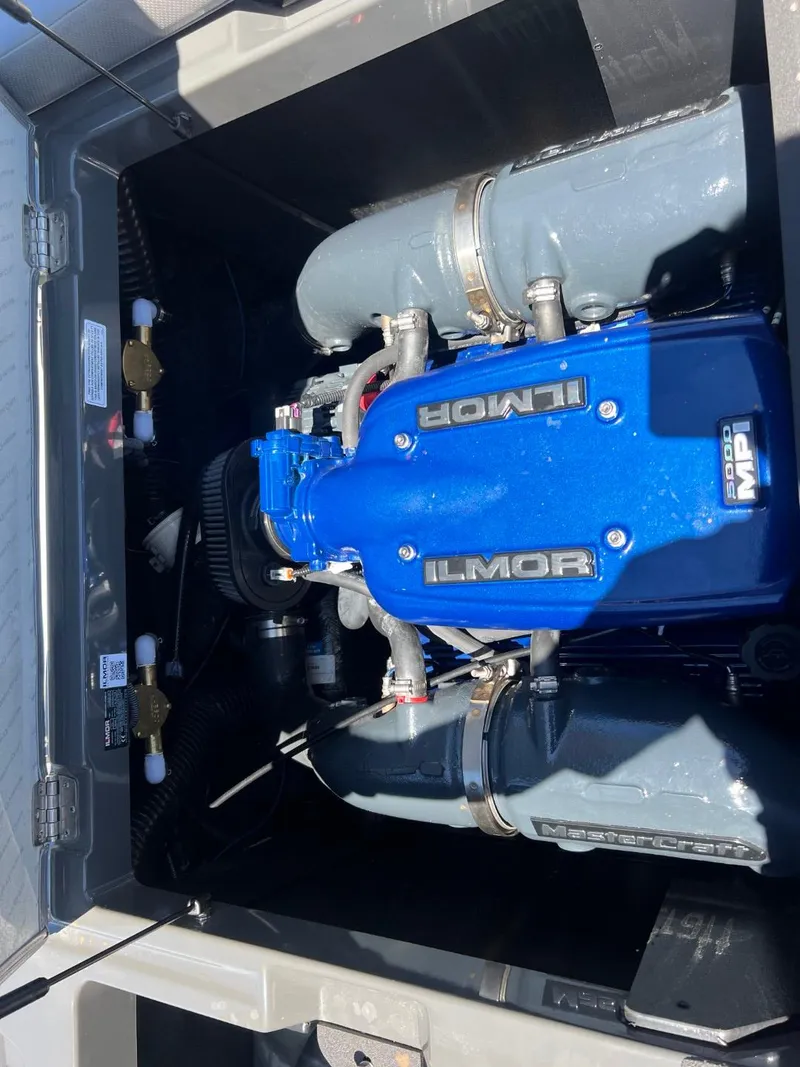 Slide: The Image of 2017 MasterCraft XT21 Ilmor engine, blue cover, detailed view. - 16