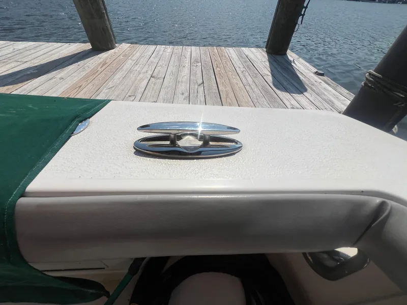 Slide: The Image of 1996 Egg Harbor Convertible boat detail with dock and water view. - 19