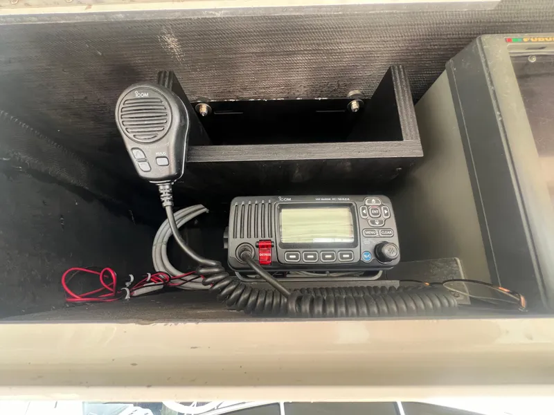 Slide: The Image of ICOM marine radio setup on 1996 Egg Harbor Convertible boat. - 23