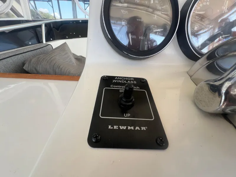 Slide: The Image of 1996 Egg Harbor Convertible boat dashboard with anchor windlass control switch. - 27