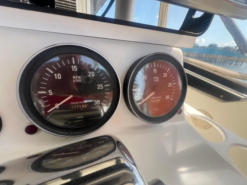 Slide: The Image of Close-up of 1996 Egg Harbor Convertible boat tachometers showing RPM and engine hours. - 28