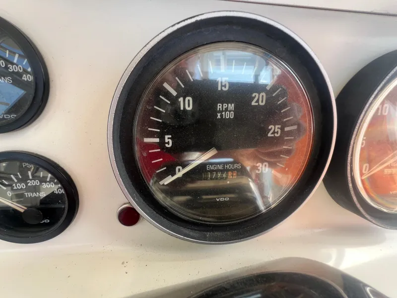 Slide: The Image of Close-up of 1996 Egg Harbor Convertible boat gauges showing RPM and engine hours. - 29