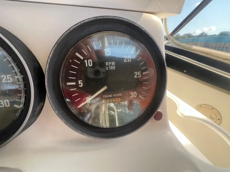 Slide: The Image of Tachometer of 1996 Egg Harbor Convertible boat showing RPM and engine hours. - 30