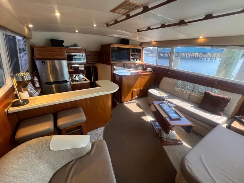 Slide: The Image of Luxurious 1996 Egg Harbor Convertible yacht interior with modern kitchen and cozy seating area. - 41