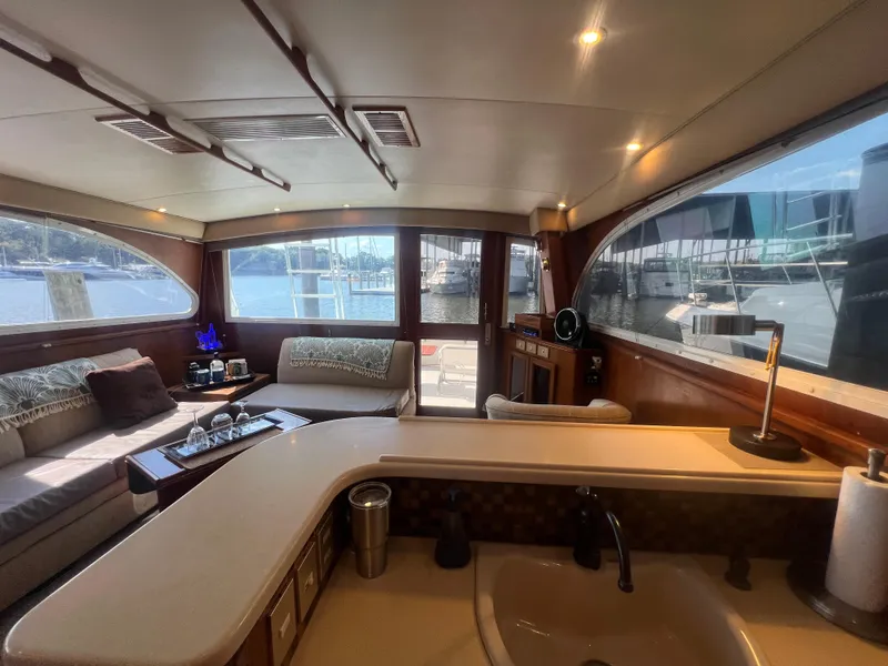 Slide: The Image of Luxurious 1996 Egg Harbor Convertible yacht interior with spacious seating and waterfront view. - 46