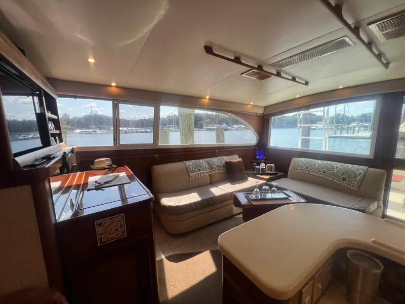 Slide: The Image of Luxurious interior of a 1996 Egg Harbor Convertible yacht with waterfront views. - 47