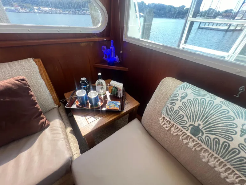 Slide: The Image of Cozy interior of 1996 Egg Harbor Convertible yacht with drinks and scenic window view. - 49