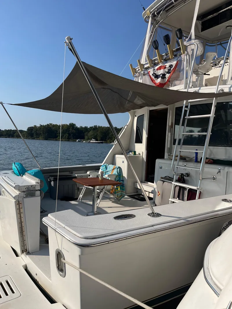 Slide: The Image of 1996 Egg Harbor Convertible yacht with shaded deck on a sunny day. - 5
