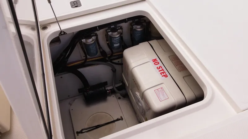 Slide: The Image of 2020 Pursuit OS 385 Offshore engine compartment with "No Step" label. - 13
