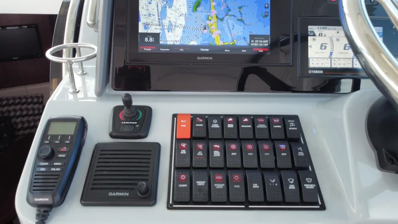 Slide: The Image of Control panel of 2020 Pursuit OS 385 Offshore boat with navigation and communication equipment. - 17