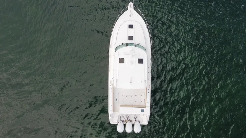 Slide: The Image of Aerial view of 2020 Pursuit OS 385 Offshore boat on water. - 39