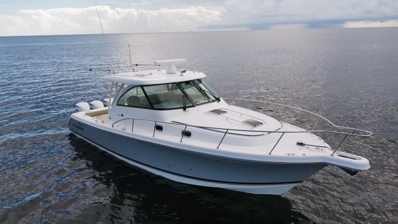 Slide: The Image of 2020 Pursuit OS 385 Offshore boat on calm ocean waters. - 41