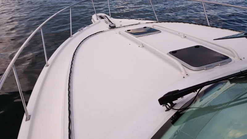 Slide: The Image of 2020 Pursuit OS 385 Offshore boat deck on calm water. - 43