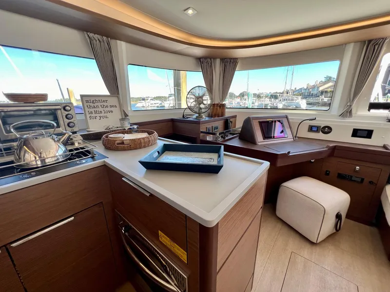Slide: The Image of Interior of 2022 Lagoon 46 yacht with modern kitchen and panoramic windows. - 21