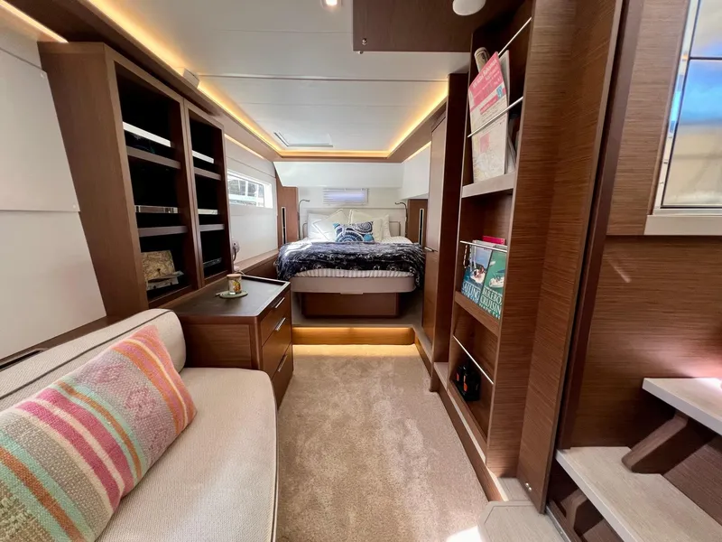 Slide: The Image of Luxurious interior of 2022 Lagoon 46 yacht with cozy bedroom and elegant wood finishes. - 23