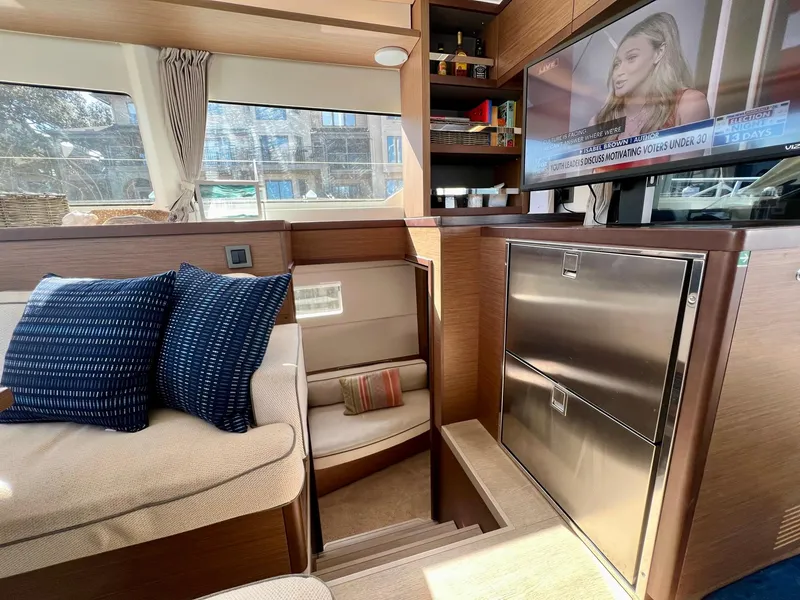 Slide: The Image of Interior of 2022 Lagoon 46 yacht with cozy seating and modern amenities. - 29