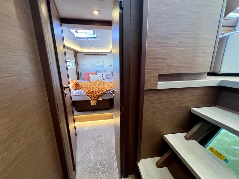 Slide: The Image of Interior of 2022 Lagoon 46 yacht, featuring a cozy bedroom with modern design. - 32